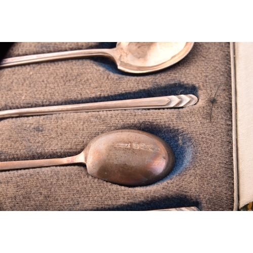 200 - A collection of assorted silver items, including several teaspoons, sugar cube tongs, hand held mirr... 