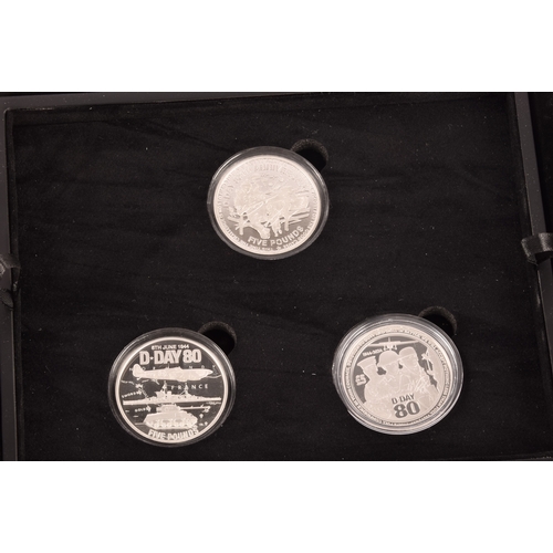 146 - A collection of silver proof coin sets, including a Dambusters 80th anniversary silver three coin se... 