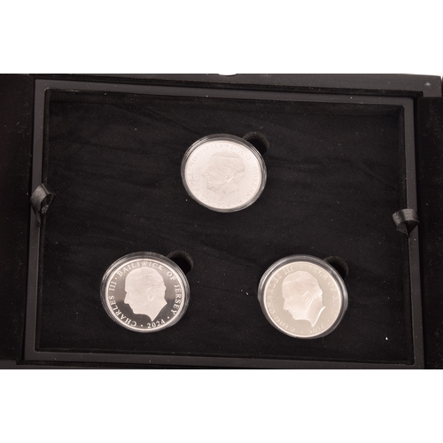 146 - A collection of silver proof coin sets, including a Dambusters 80th anniversary silver three coin se... 