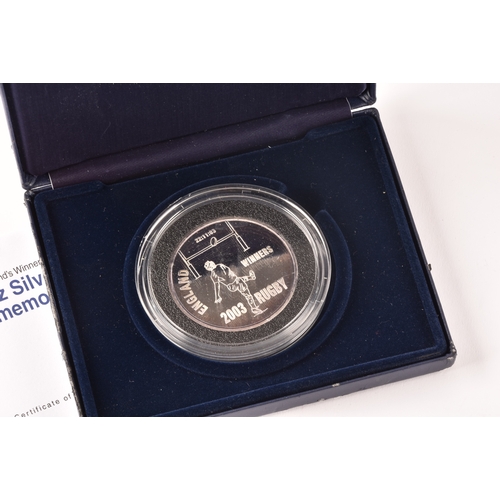 153 - A collection of commemorative silver coins, including the Queen Elizabeth II memorial fine silver pr... 