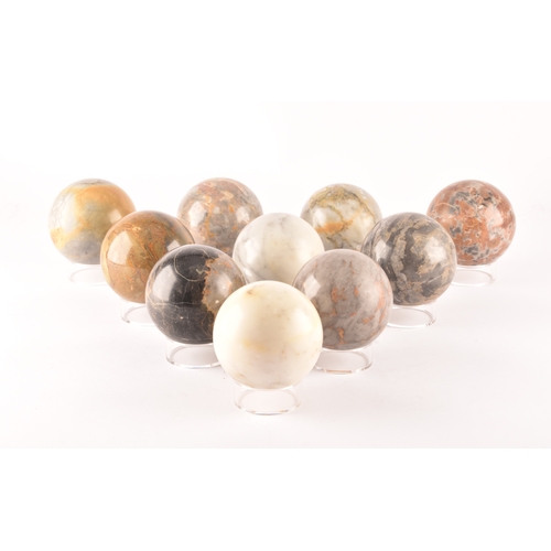 333 - A group of ten specimen marble spheres on stands, each approximately 9cm diameter. (10)