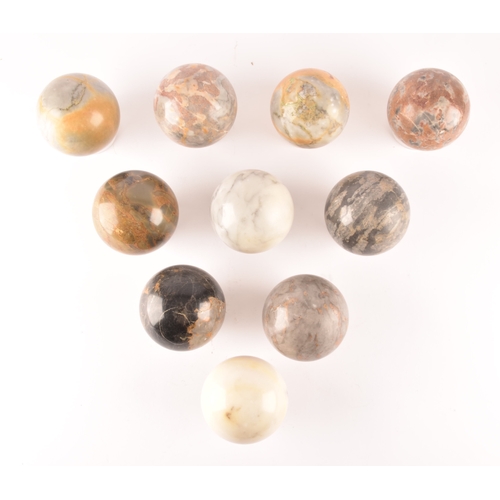 333 - A group of ten specimen marble spheres on stands, each approximately 9cm diameter. (10)