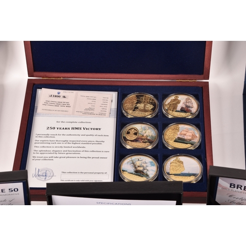 154 - A collection of silver collectors coins sets, including the 70th anniversary of the Queen's Coronati... 