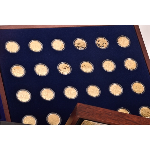 155 - A collection of gold plated collectors coins, including head of the house of Windsor, Westminster, S... 