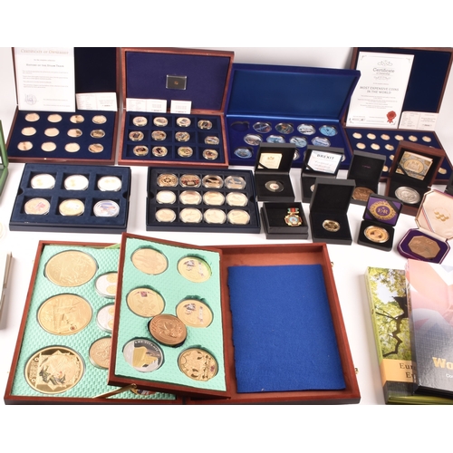 155 - A collection of gold plated collectors coins, including head of the house of Windsor, Westminster, S... 