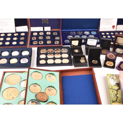 155 - A collection of gold plated collectors coins, including head of the house of Windsor, Westminster, S... 