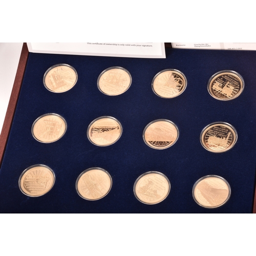 155 - A collection of gold plated collectors coins, including head of the house of Windsor, Westminster, S... 