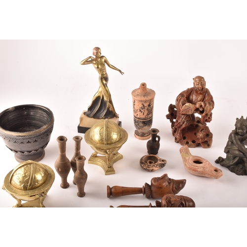 132 - A collection of decorative items including copies of the terracotta warriors, a silver topped flask ... 