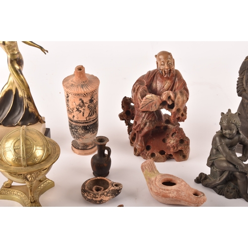 132 - A collection of decorative items including copies of the terracotta warriors, a silver topped flask ... 