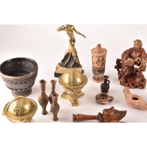 132 - A collection of decorative items including copies of the terracotta warriors, a silver topped flask ... 