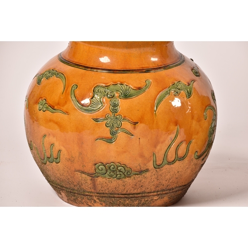 243 - A very large pair of Chinese yellow glazed doubled gourd garden vases, decorated in green with bats ... 