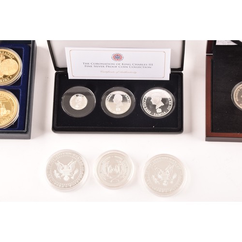 148 - A collection of silver commemorative coin sets including: The Coronation of King Charles III fine si... 