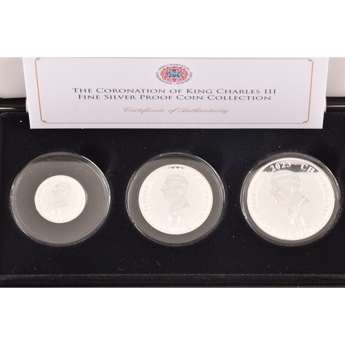 148 - A collection of silver commemorative coin sets including: The Coronation of King Charles III fine si... 