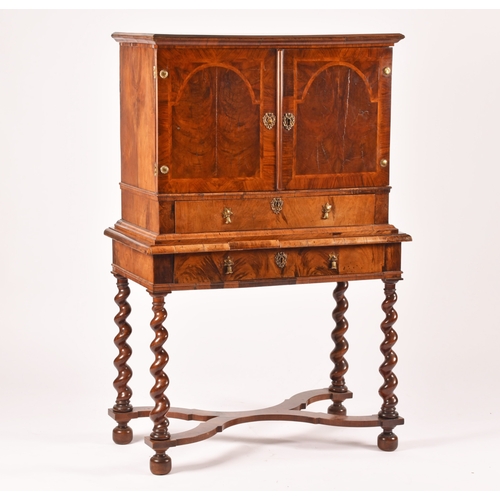 365 - An early 18th century William and Mary figured walnut chest on stand, the top with a pair of doors w... 