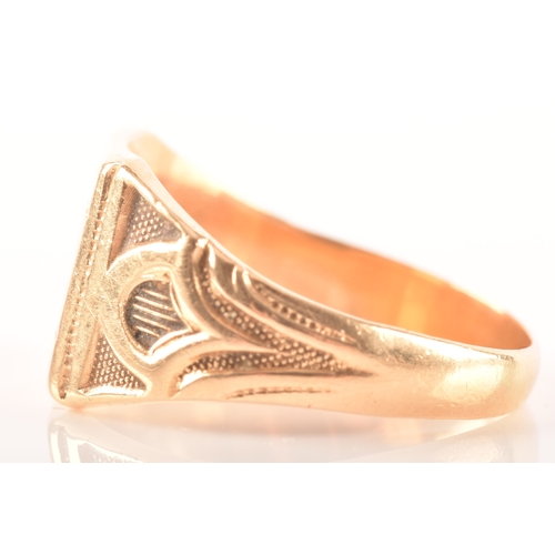 27 - An 18ct yellow gold signet ring, with engraved initials and carved detailing to shoulders, size T, a... 