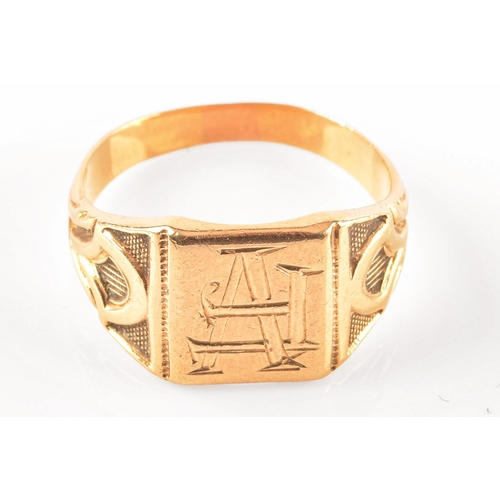 27 - An 18ct yellow gold signet ring, with engraved initials and carved detailing to shoulders, size T, a... 