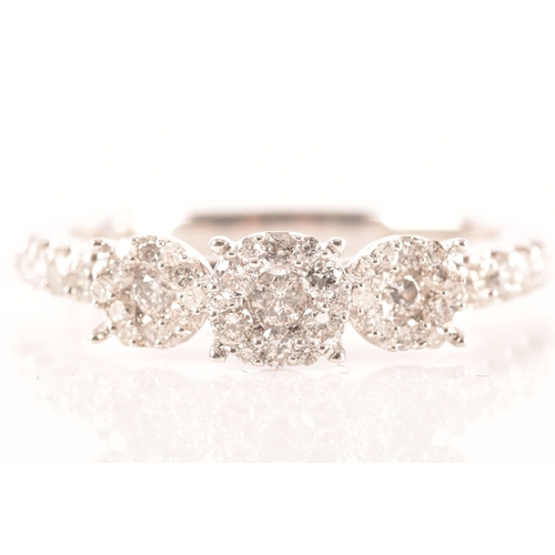 28 - 18ct white gold diamond cluster ring, formed of three round brilliant cut diamond clusters, with bri... 