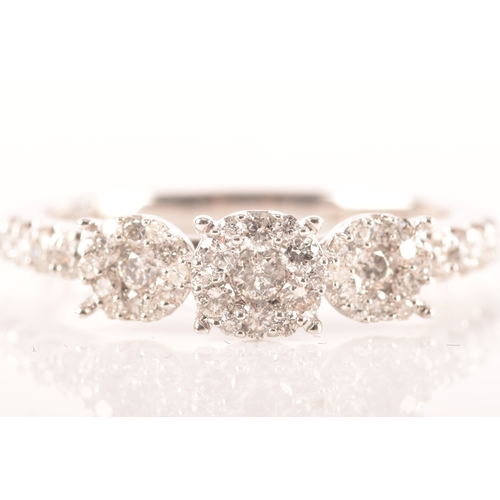 28 - 18ct white gold diamond cluster ring, formed of three round brilliant cut diamond clusters, with bri... 