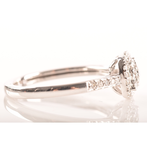 34 - An 18ct white gold diamond square cluster ring, set to centre with a cluster of brilliant cut diamon... 