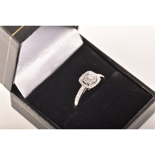 34 - An 18ct white gold diamond square cluster ring, set to centre with a cluster of brilliant cut diamon... 