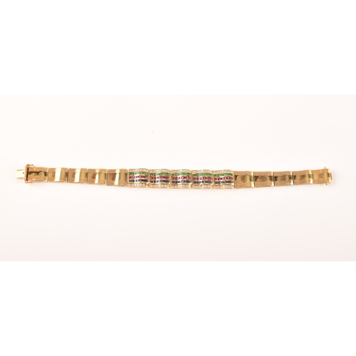 1 - An 18ct yellow gold bracelet, set with calibre cut emeralds, rubies and sapphires, further set with ... 