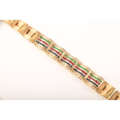 1 - An 18ct yellow gold bracelet, set with calibre cut emeralds, rubies and sapphires, further set with ... 