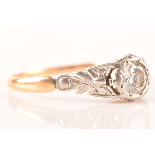 73 - An 18ct yellow gold and platinum vintage diamond solitaire ring, set to centre with a round brillian... 