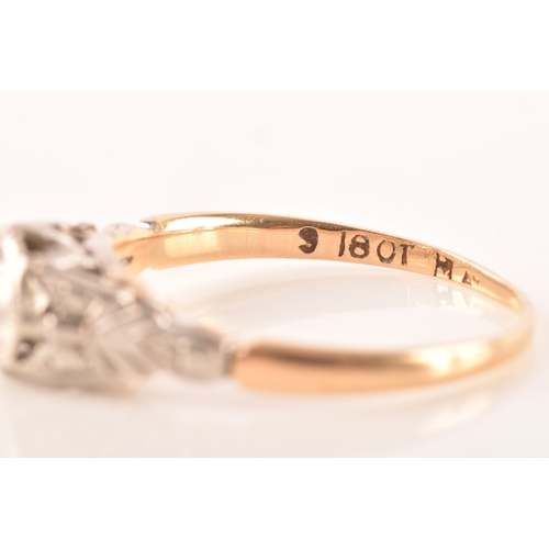 73 - An 18ct yellow gold and platinum vintage diamond solitaire ring, set to centre with a round brillian... 