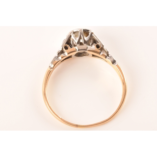 73 - An 18ct yellow gold and platinum vintage diamond solitaire ring, set to centre with a round brillian... 