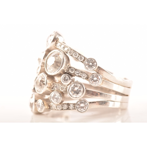 13 - A Boodles style impressive platinum and diamond 'waterfall' ring, featuring a twenty-four brilliant ... 