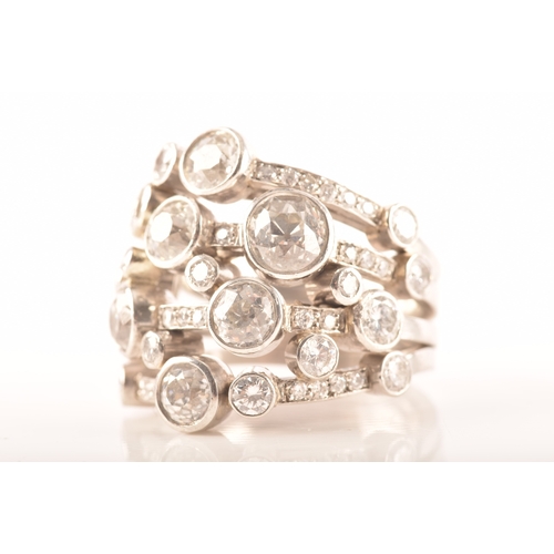 13 - A Boodles style impressive platinum and diamond 'waterfall' ring, featuring a twenty-four brilliant ... 