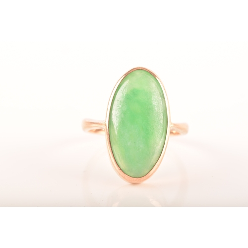 75 - A 9ct yellow gold ring, set with a oval cabochon jadeite measuring approximately 16 x .5 mm, size F,... 