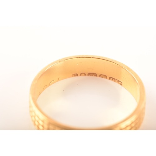 35 - A pair of two 22ct yellow gold wedding bands, with linear engraving, partial hallmarks for London, o... 