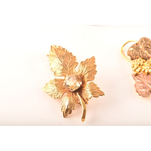 36 - A group of gold jewellery including a 9ct yellow gold citrine leaf brooch, a 9ct golf leaf and grape... 