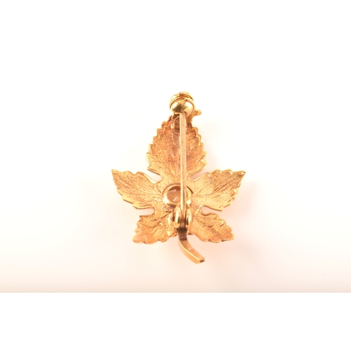 36 - A group of gold jewellery including a 9ct yellow gold citrine leaf brooch, a 9ct golf leaf and grape... 