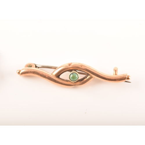 69 - A 15ct yellow gold and nephrite twist brooch, together with a 9ct rose gold bow brooch and a 9ct yel... 