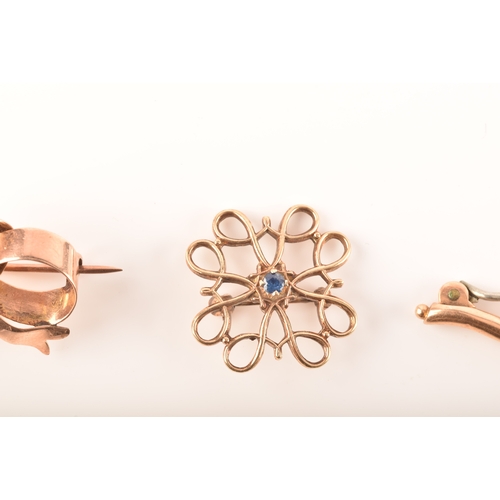 69 - A 15ct yellow gold and nephrite twist brooch, together with a 9ct rose gold bow brooch and a 9ct yel... 