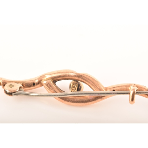 69 - A 15ct yellow gold and nephrite twist brooch, together with a 9ct rose gold bow brooch and a 9ct yel... 