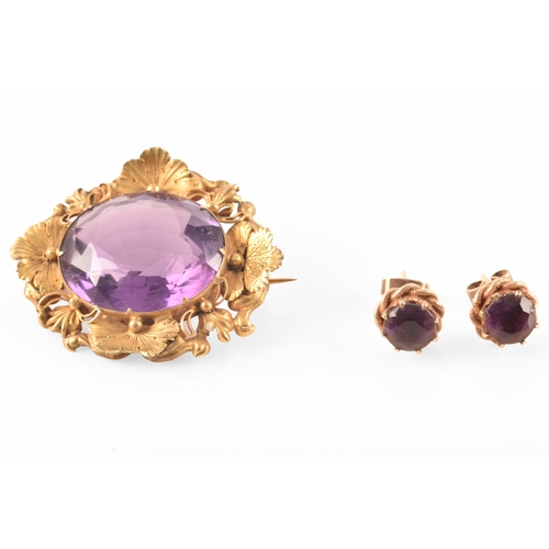 102 - A pair of 9ct gold amethyst earrings, together with a yellow metal amethyst brooch. (2)