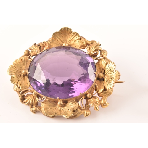 102 - A pair of 9ct gold amethyst earrings, together with a yellow metal amethyst brooch. (2)