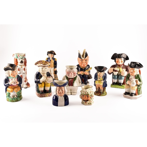 315 - A collection of Staffordshire Toby jugs, including a Staffordshire figure of Nelson, a figure of Win... 