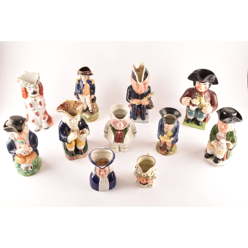 315 - A collection of Staffordshire Toby jugs, including a Staffordshire figure of Nelson, a figure of Win... 