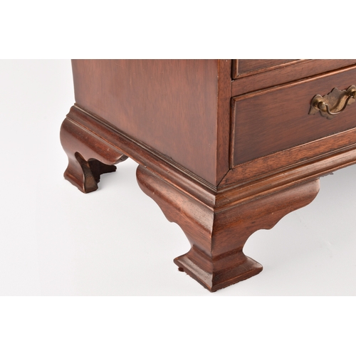 371 - An early 20th century miniature apprentice piece bureau, fall front with fitted interior over two sh... 