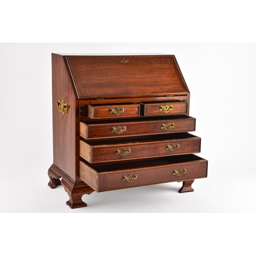 371 - An early 20th century miniature apprentice piece bureau, fall front with fitted interior over two sh... 