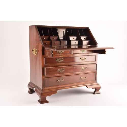 371 - An early 20th century miniature apprentice piece bureau, fall front with fitted interior over two sh... 