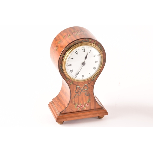 354 - An Edwardian painted satinwood balloon clock with white dial and black Roman numerals, together with... 