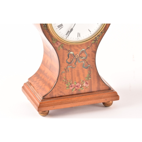 354 - An Edwardian painted satinwood balloon clock with white dial and black Roman numerals, together with... 