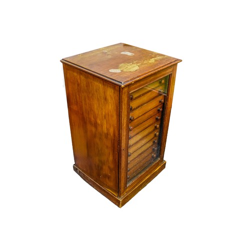 390 - A Victorian mahogany collectors or music cabinet, the single glazed door opening to reveal twelve sm... 