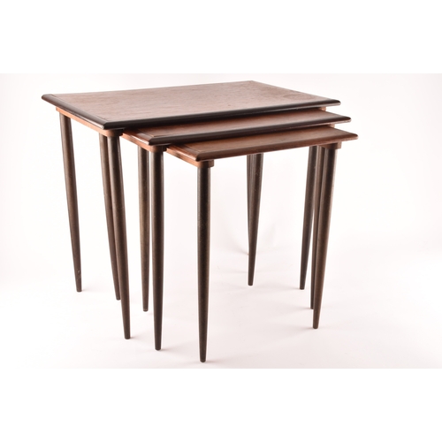 363 - A nest of three Danish rosewood occasional tables, with rounded edges and turned tapering legs, larg... 