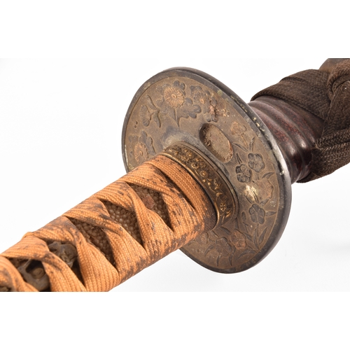 291 - A 19th century Japanese Katana sword, the bronze Tsuba decorated with glided flowers and leaves, in ... 